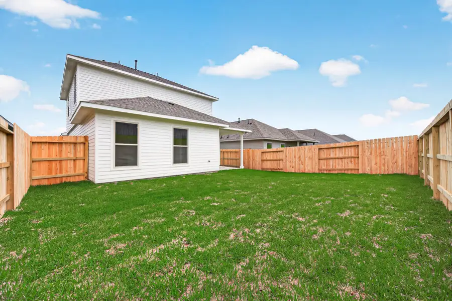 Exterior details and patio area of a home in Mostyn Springs, Magnolia (Image 25).