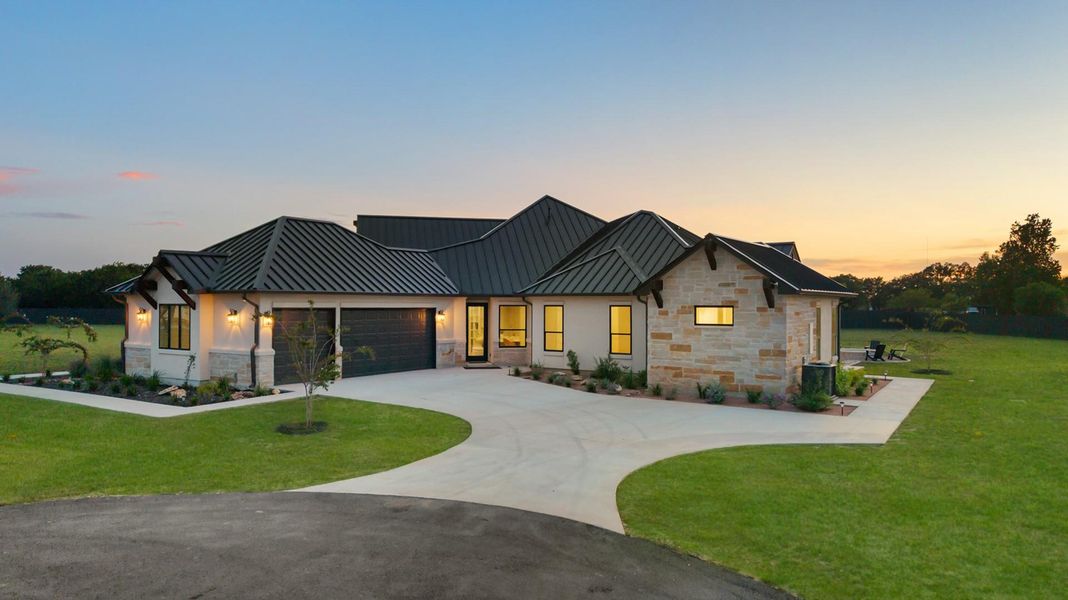 Front exterior of a new home in , Liberty Hill, TX, highlighting curb appeal (Image 2). Front exterior of a new home in , Liberty Hill, TX, highlighting curb appeal (Image 2).