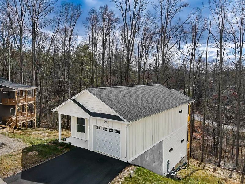 Front exterior of a new home in , Asheville, NC, highlighting curb appeal (Image 17).