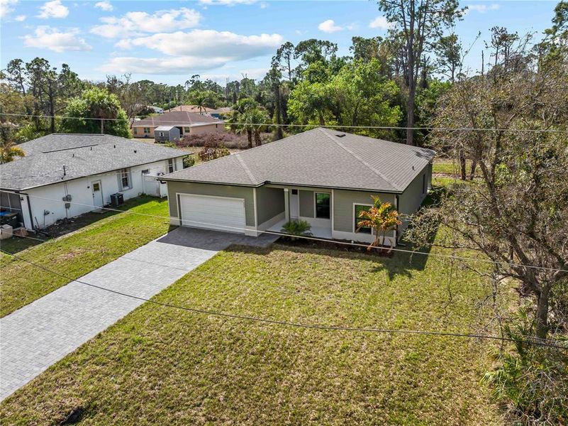 Front exterior of a new home in , North Port, FL, highlighting curb appeal (Image 24).