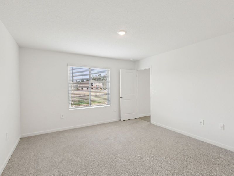 Spacious, unfurnished interior of a new home in Colbert Landings - Signature Series, Palm Coast (Image 8).