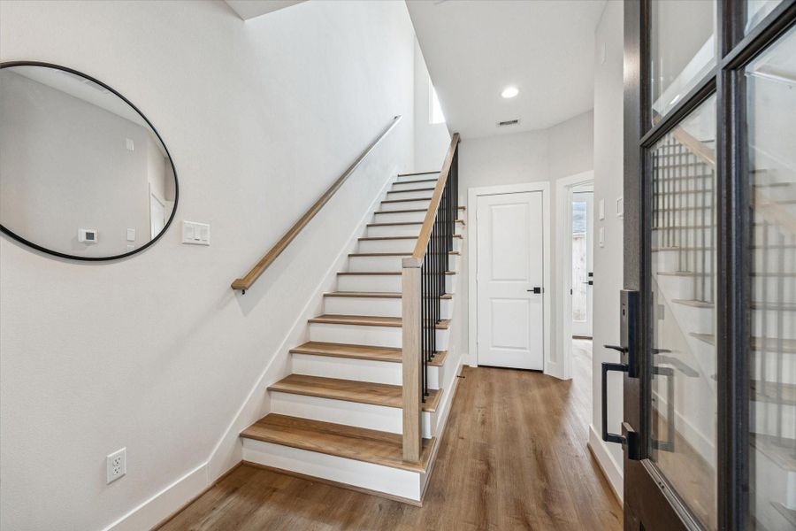 Welcome guests through the stylish front door. At the end of the hallway, you’ll find a door leading to a storage closet.