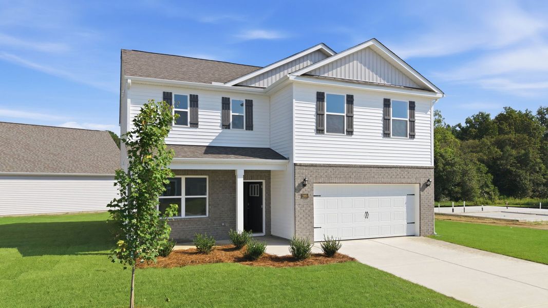 Front exterior of a new home in Villa Grande, Winterville, NC, highlighting curb appeal (Image 2). Front exterior of a new home in Villa Grande, Winterville, NC, highlighting curb appeal (Image 2).