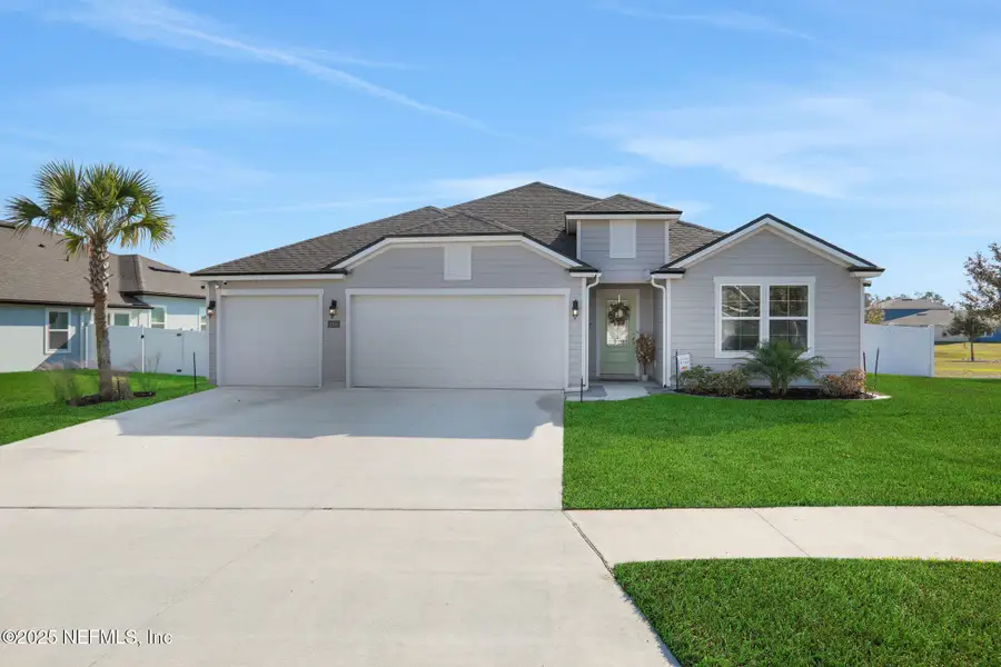 Front exterior of a new home in Cross Creek, Green Cove Springs, FL, highlighting curb appeal (Image 1).
