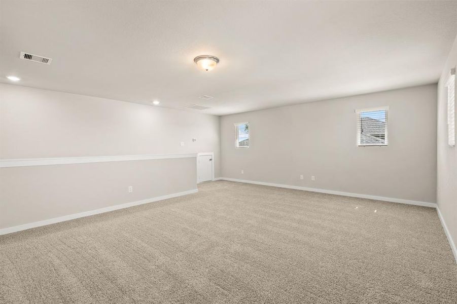 Spacious Flex Space located on the second level offers plush carpet, attic access, high ceilings and plenty of space for all your entertaining needs!