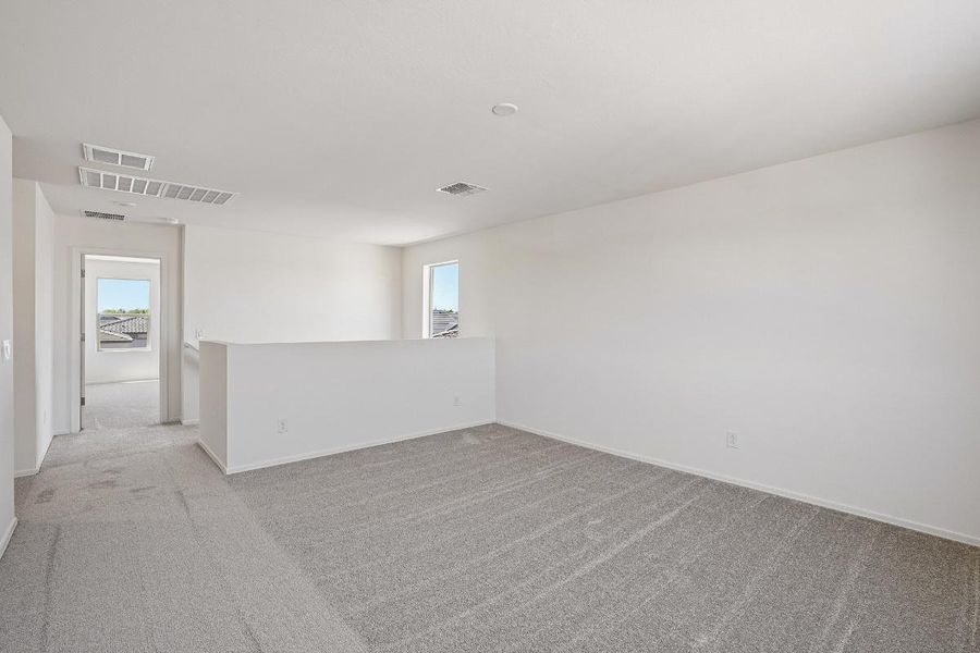 Spacious, unfurnished interior of a new home in Bella Camino Traditions, San Tan Valley (Image 12).