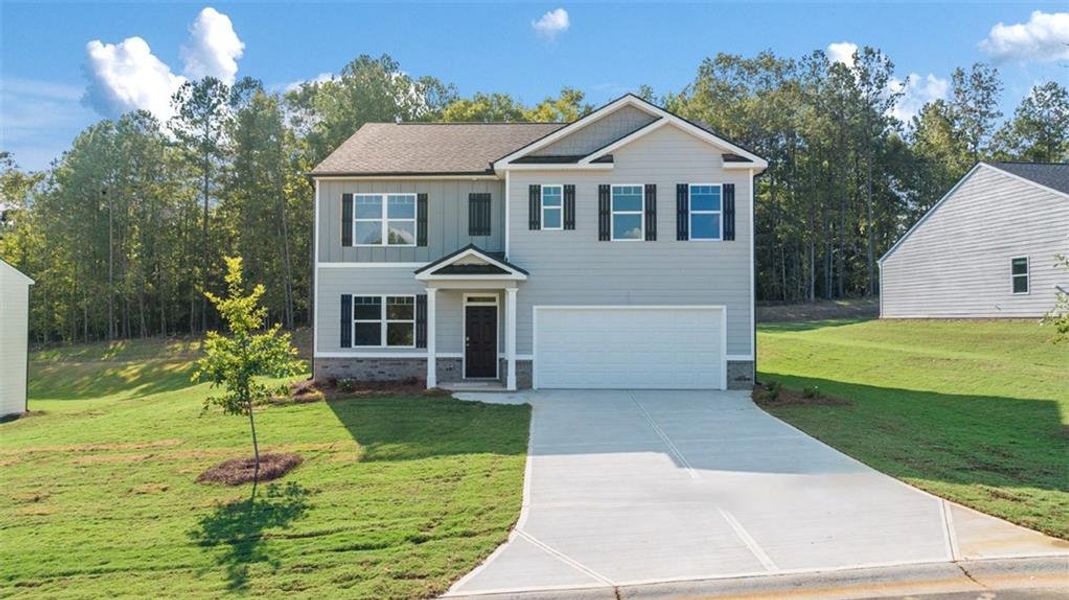 Front exterior of a new home in Kingston Ranch at Lake Oconee, Buckhead, GA, highlighting curb appeal (Image 2). Front exterior of a new home in Kingston Ranch at Lake Oconee, Buckhead, GA, highlighting curb appeal (Image 2).