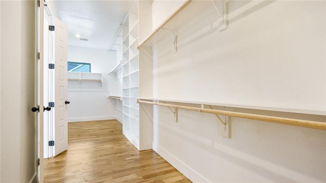 Walk in closet featuring light hardwood / wood-style floors