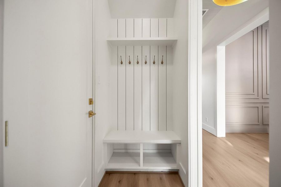 A functional vestibule designed for everyday convenience, it serves as a buffer between the outdoors and main living areas—ideal for dropping bags, shoes, and coats.