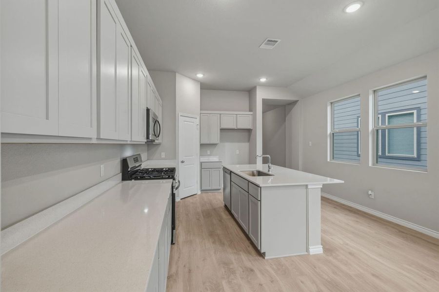 Kitchen in the Cedar home plan by Trophy Signature Homes – REPRESENTATIVE PHOTO
