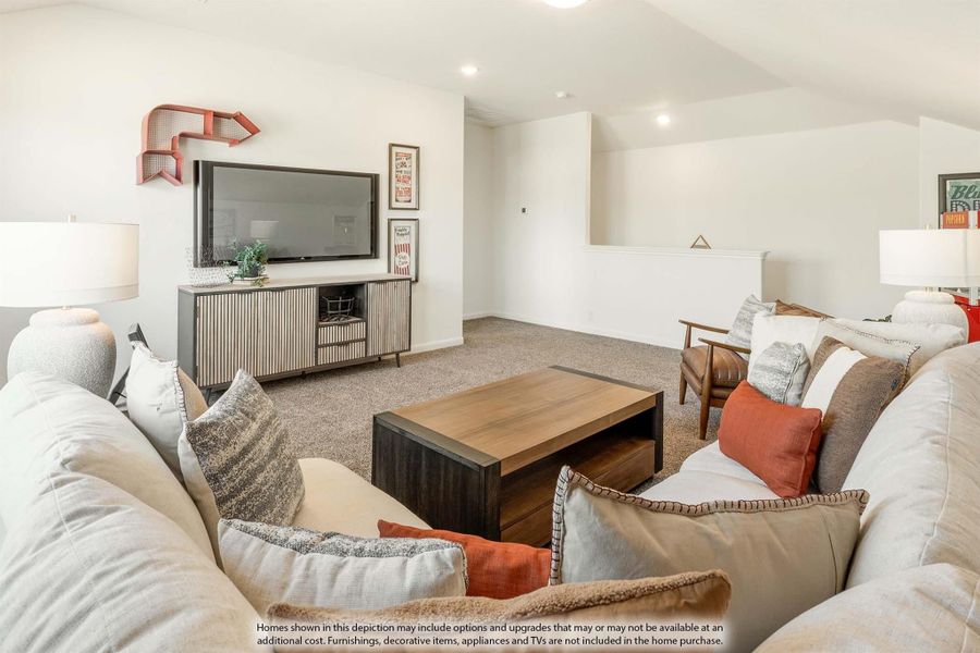 Upstairs bonus room with sectional sofa, wood coffee table, and wall-mounted TV on carpet flooring Upstairs bonus room with sectional sofa, wood coffee table, and wall-mounted TV on carpet flooring