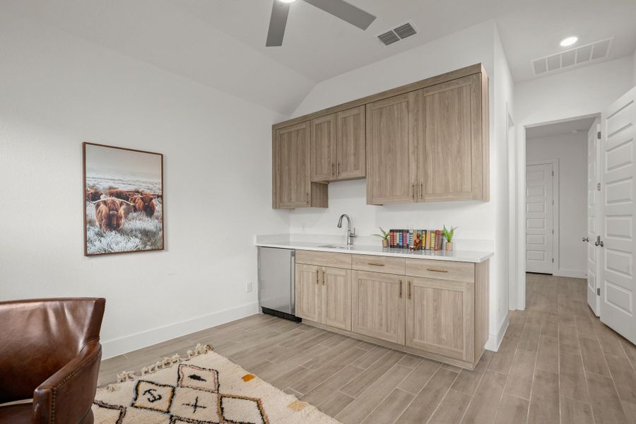 The multi-gen living space has a kitchenette and private living room with an attached bedroom and bathroom.
