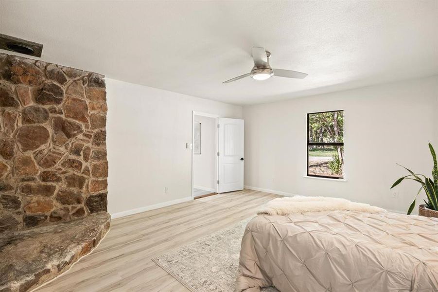 Bedroom featuring light hardwood / wood-style flooring and ceiling fan