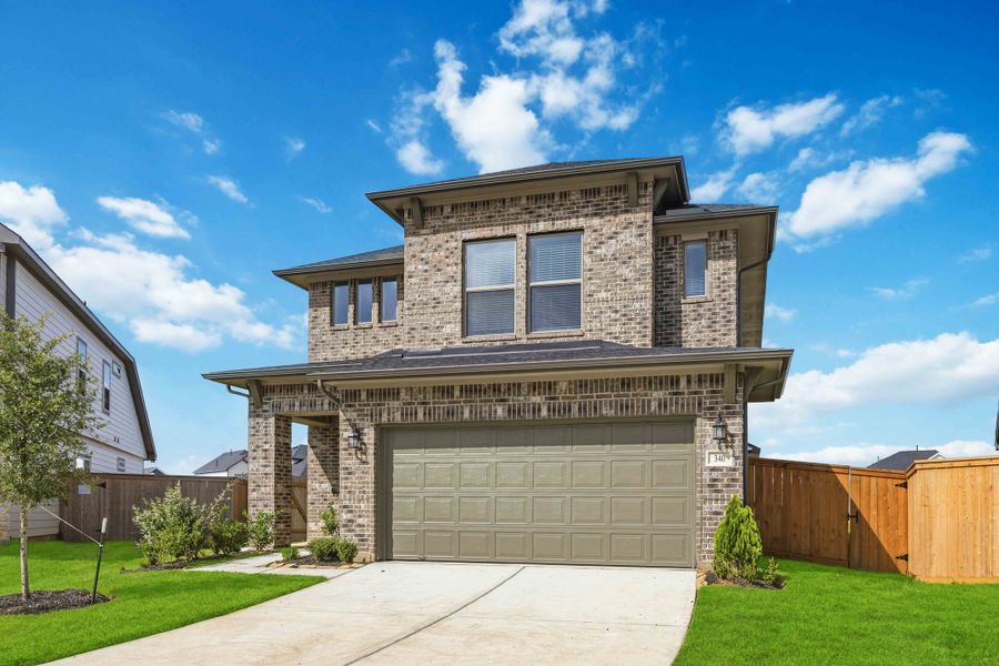 Front exterior of a new home in La Segarra 40', Brookshire, TX, highlighting curb appeal (Image 2). Front exterior of a new home in La Segarra 40', Brookshire, TX, highlighting curb appeal (Image 2).