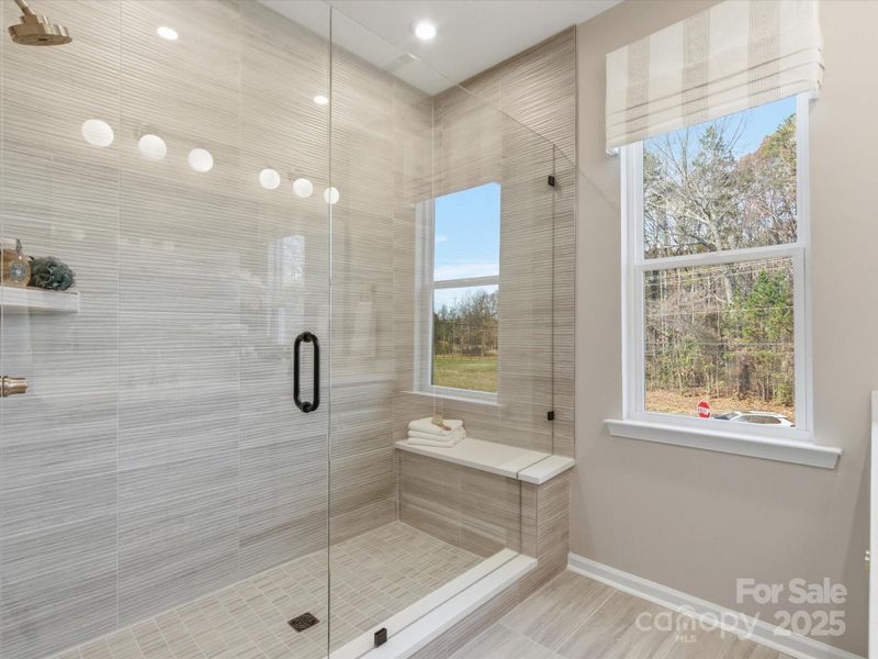 Frameless Tiled Primary Shower. *Model Photos | Actual Finishes, Structural Selections, and Orientation May Vary.