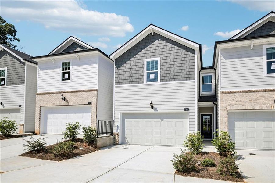 Front exterior of a new home in Artisan Walk, Fairburn, GA, highlighting curb appeal (Image 26).