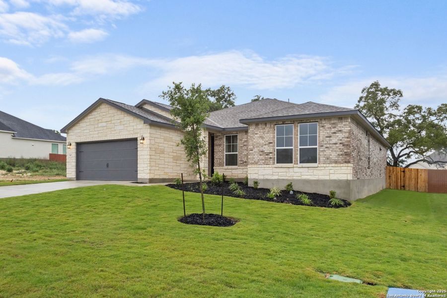 Front exterior of a new home in The Reserve at Potranco Oaks, Castroville, TX, highlighting curb appeal (Image 41).