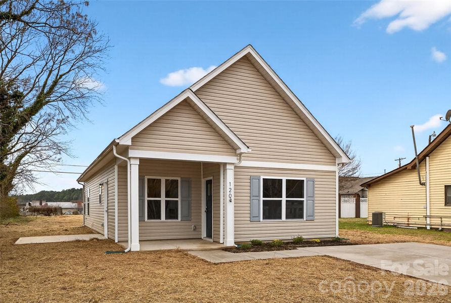 Front exterior of a new home in , East Spencer, NC, highlighting curb appeal (Image 17).