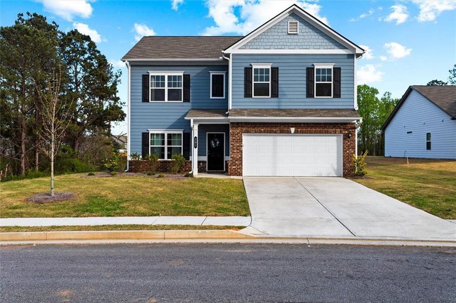 Front exterior of a new home in Garrett Preserve, Hiram, GA, highlighting curb appeal (Image 32).