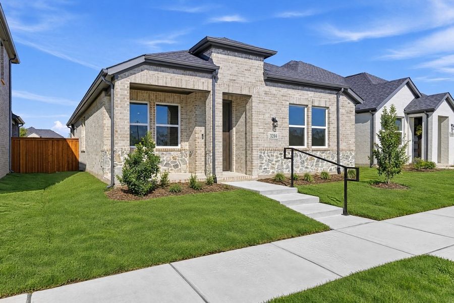 Front exterior of a new home in North Sky Celina, Celina, TX, highlighting curb appeal (Image 17). Front exterior of a new home in North Sky Celina, Celina, TX, highlighting curb appeal (Image 17).