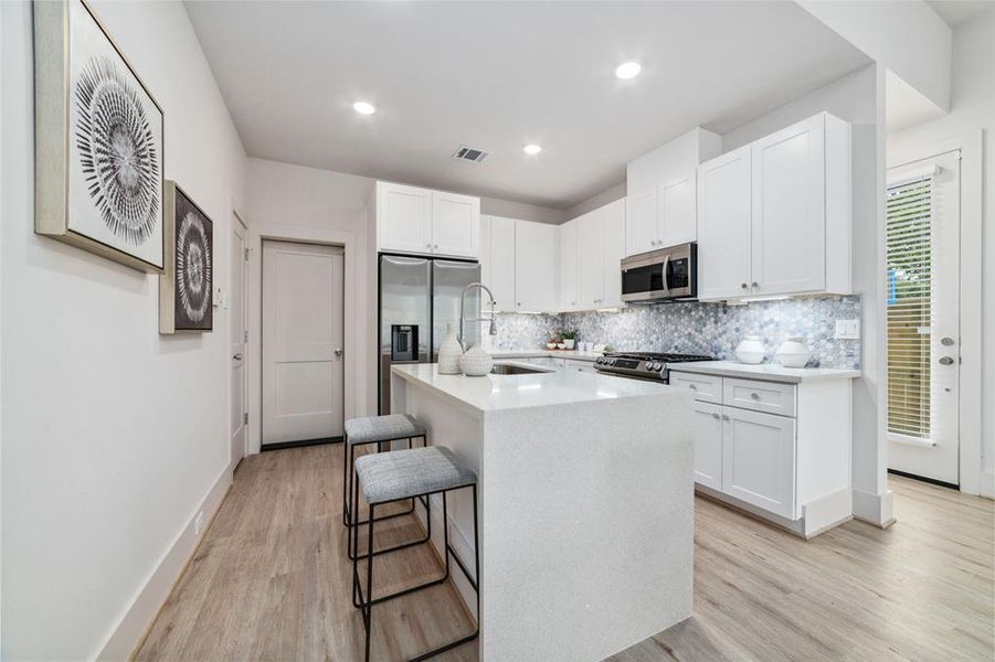 Gourmet Kitchen Will Be Any Home Chef's Dream. It Features Stunning Quartz Countertops, All Matching Appliances, Tons Of Cabinet Space And An Oversized Walk In Pantry That Fits Absolutely Everything