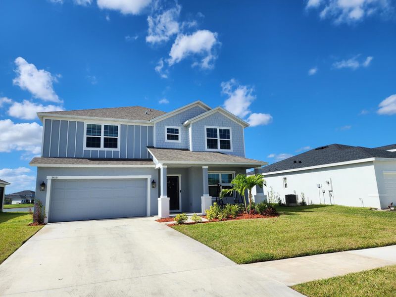 Front exterior of a new home in , Port St. Lucie, FL, highlighting curb appeal (Image 29). Front exterior of a new home in , Port St. Lucie, FL, highlighting curb appeal (Image 29).