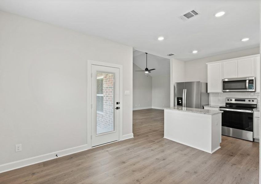 The dining room of the Sabine floor plan sits right off of the kitchen.