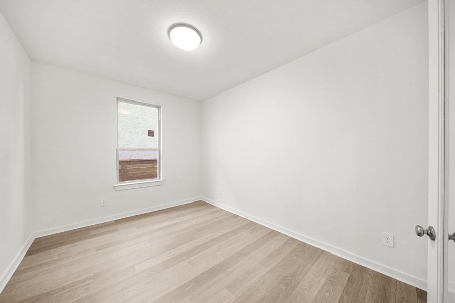 A quiet study with a large window that provides natural light and a peaceful workspace. A quiet study with a large window that provides natural light and a peaceful workspace.