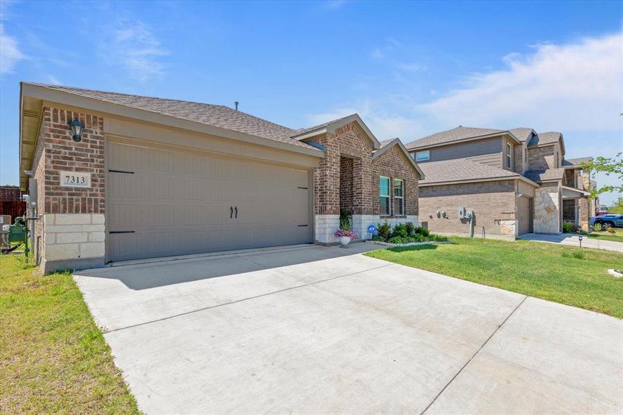 Front exterior of a new home in Millstone, McKinney, TX, highlighting curb appeal (Image 2). Front exterior of a new home in Millstone, McKinney, TX, highlighting curb appeal (Image 2).