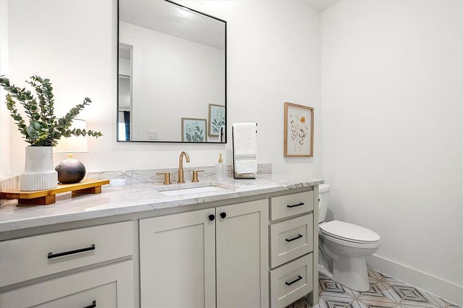 Bathroom with vanity and toilet