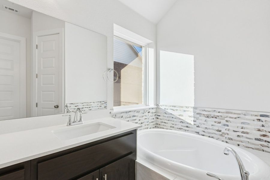 Furnished interior view inside a new home in The Colony, Bastrop (Image 13).