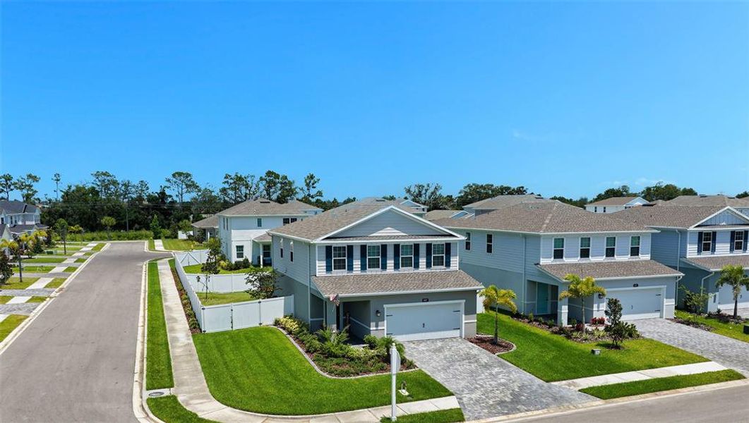 Front exterior of a new home in , Bradenton, FL, highlighting curb appeal (Image 23).