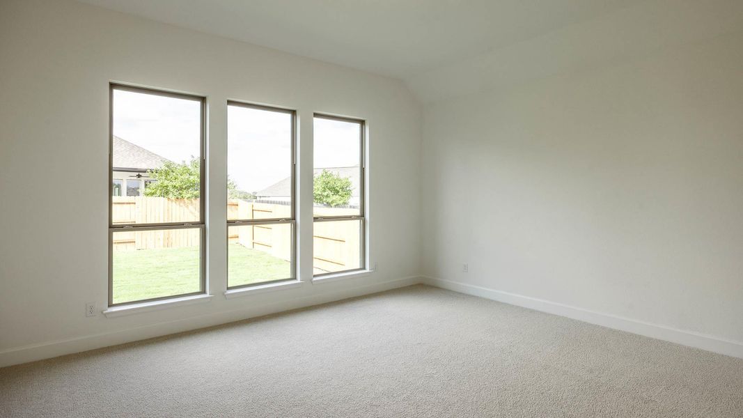Unfurnished room with carpet and baseboards