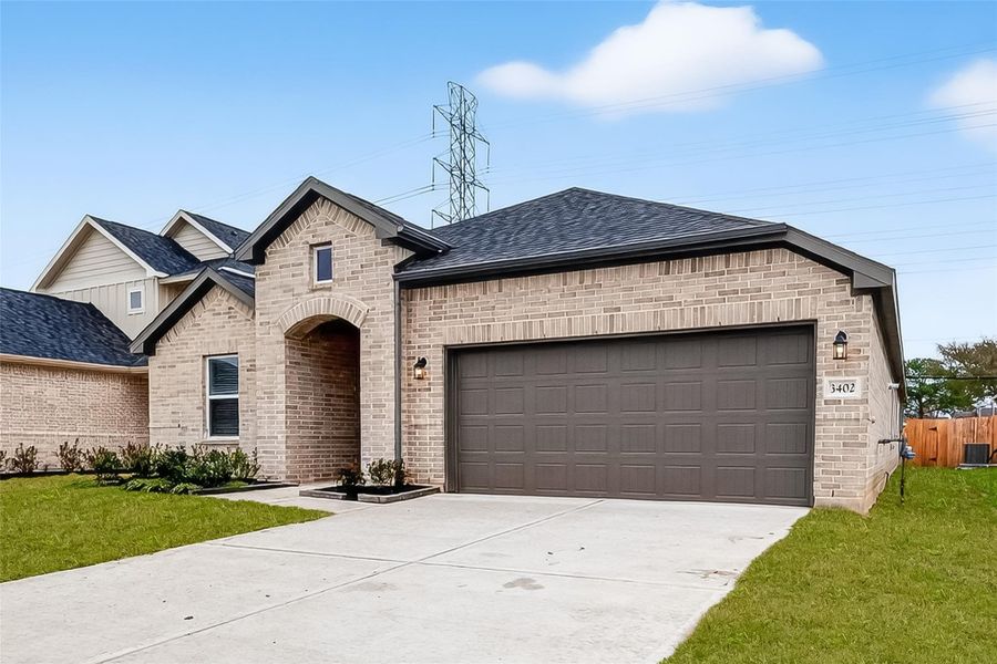 Front exterior of a new home in Rollingbrook Estates, Baytown, TX, highlighting curb appeal (Image 26).