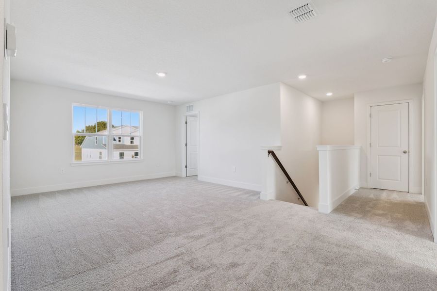 Representative unfurnished interior of a home built from the Clementine by Hartizen Homes in Eden Crest, Apopka (Image 18).
