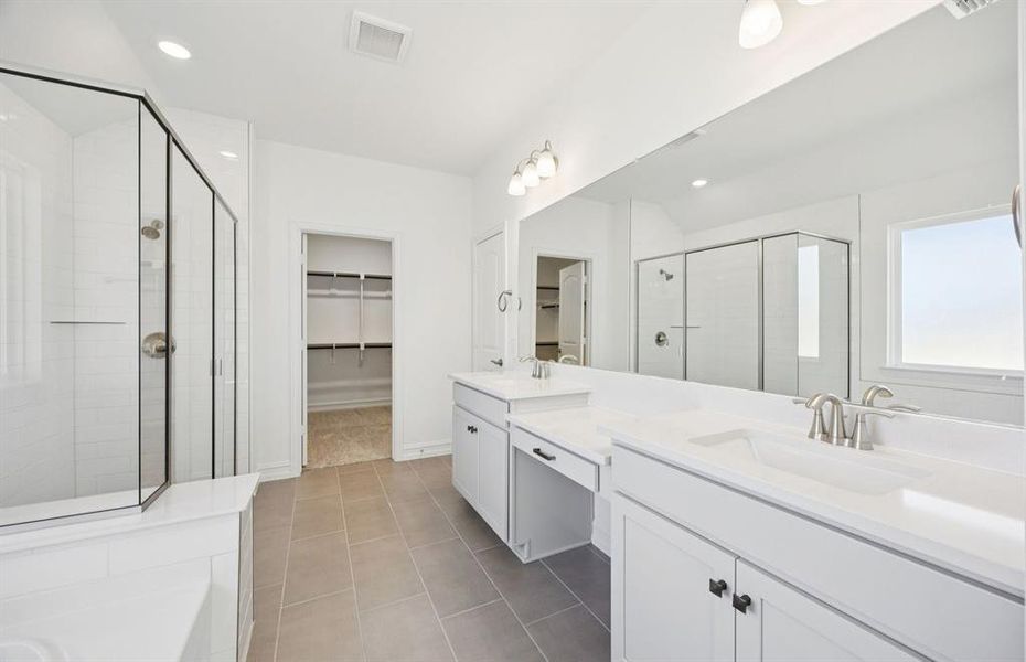 Modern owner's bath with dual vanities and a spacious shower Modern owner's bath with dual vanities and a spacious shower