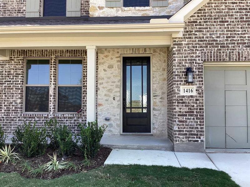 Front exterior of a new home in , Celina, TX, highlighting curb appeal (Image 2). Front exterior of a new home in , Celina, TX, highlighting curb appeal (Image 2).