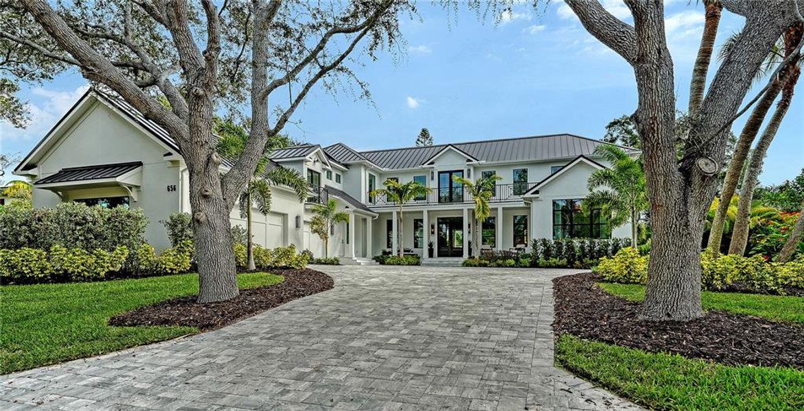 Front exterior of a new home in , Sarasota, FL, highlighting curb appeal (Image 1).