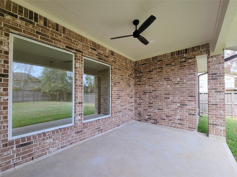 Exterior details and patio area of a home in , Conroe (Image 26).