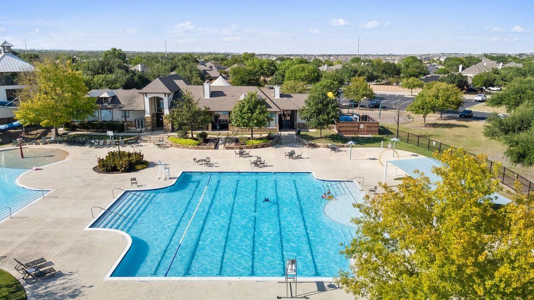 Large community pool with lap lanes and ample seating, perfect for summer days. Large community pool with lap lanes and ample seating, perfect for summer days.
