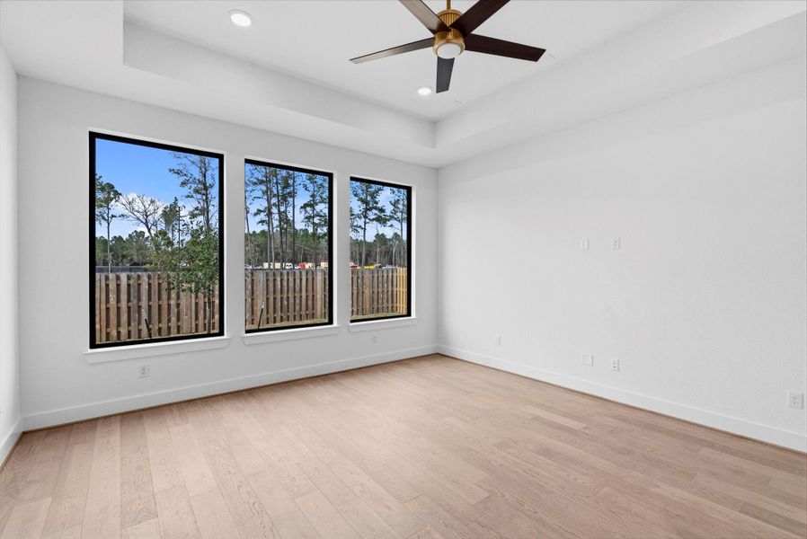 Very spacious, primary suite bedroom.