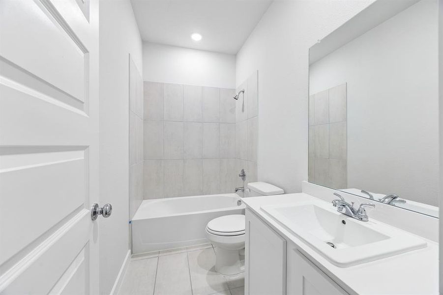 Bathroom in the Cedar home plan by Trophy Signature Homes – REPRESENTATIVE PHOTO