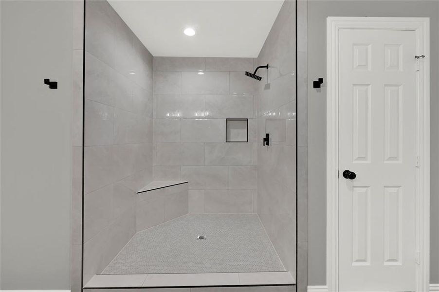 Primary Bathroom with dual vanity and free standing tub