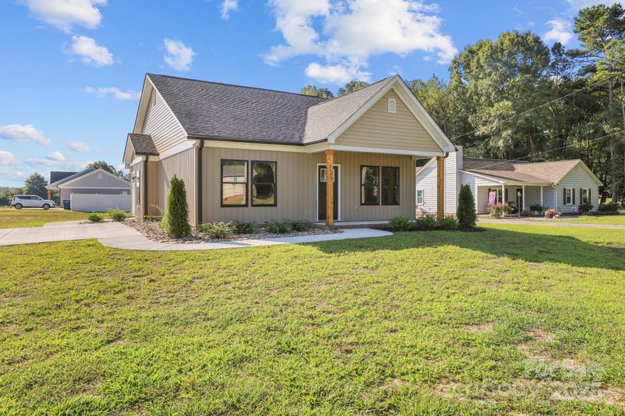 Front exterior of a new home in , Albemarle, NC, highlighting curb appeal (Image 18).
