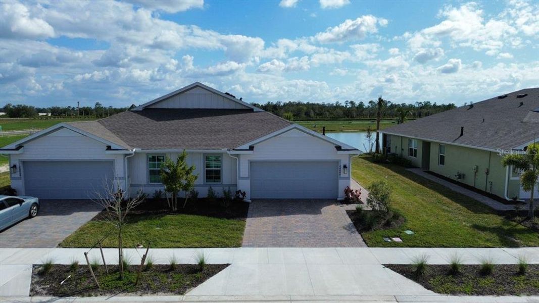Front exterior of a new home in , Punta Gorda, FL, highlighting curb appeal (Image 1).