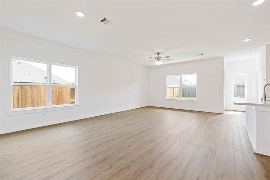 Spacious, unfurnished interior of a new home in Sunterra, Katy (Image 29).