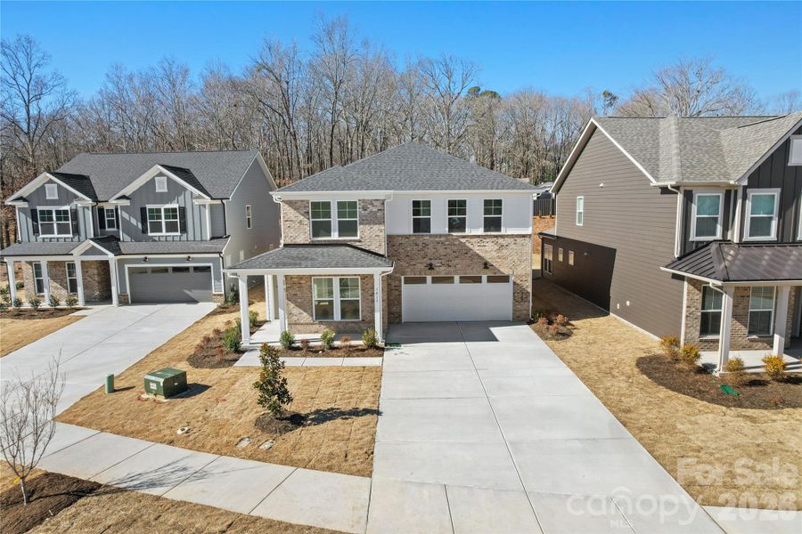 Front exterior of a new home in Elmbrook, Indian Trail, NC, highlighting curb appeal (Image 22).