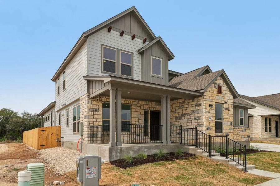Front exterior of a new home in Sage Hollow, Kyle, TX, highlighting curb appeal (Image 2).
