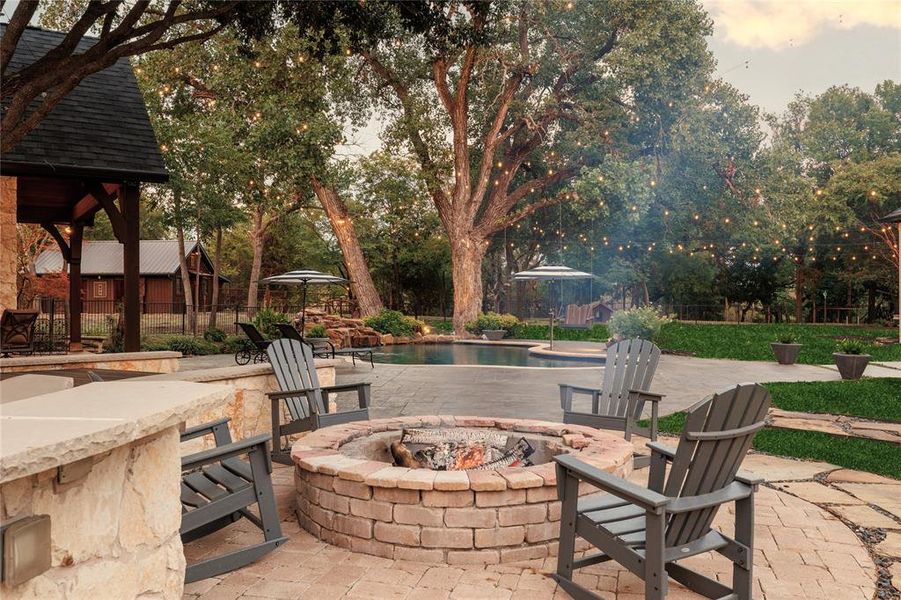 View of patio / terrace with an outdoor fire pit