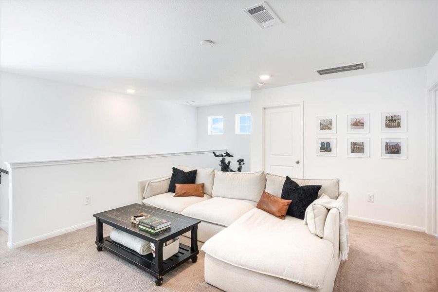 Upstairs gameroom is the perfect place to relax after a long day.  There is even a space for that piece of workout equipment that always seems to be in the way.